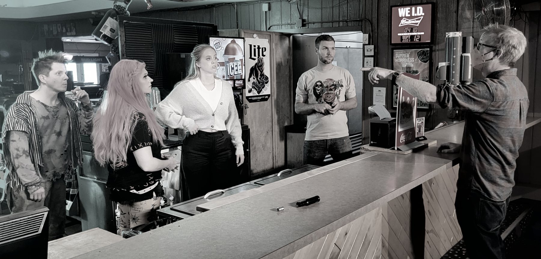 A black-and-white production moment during one of the bar scenes.