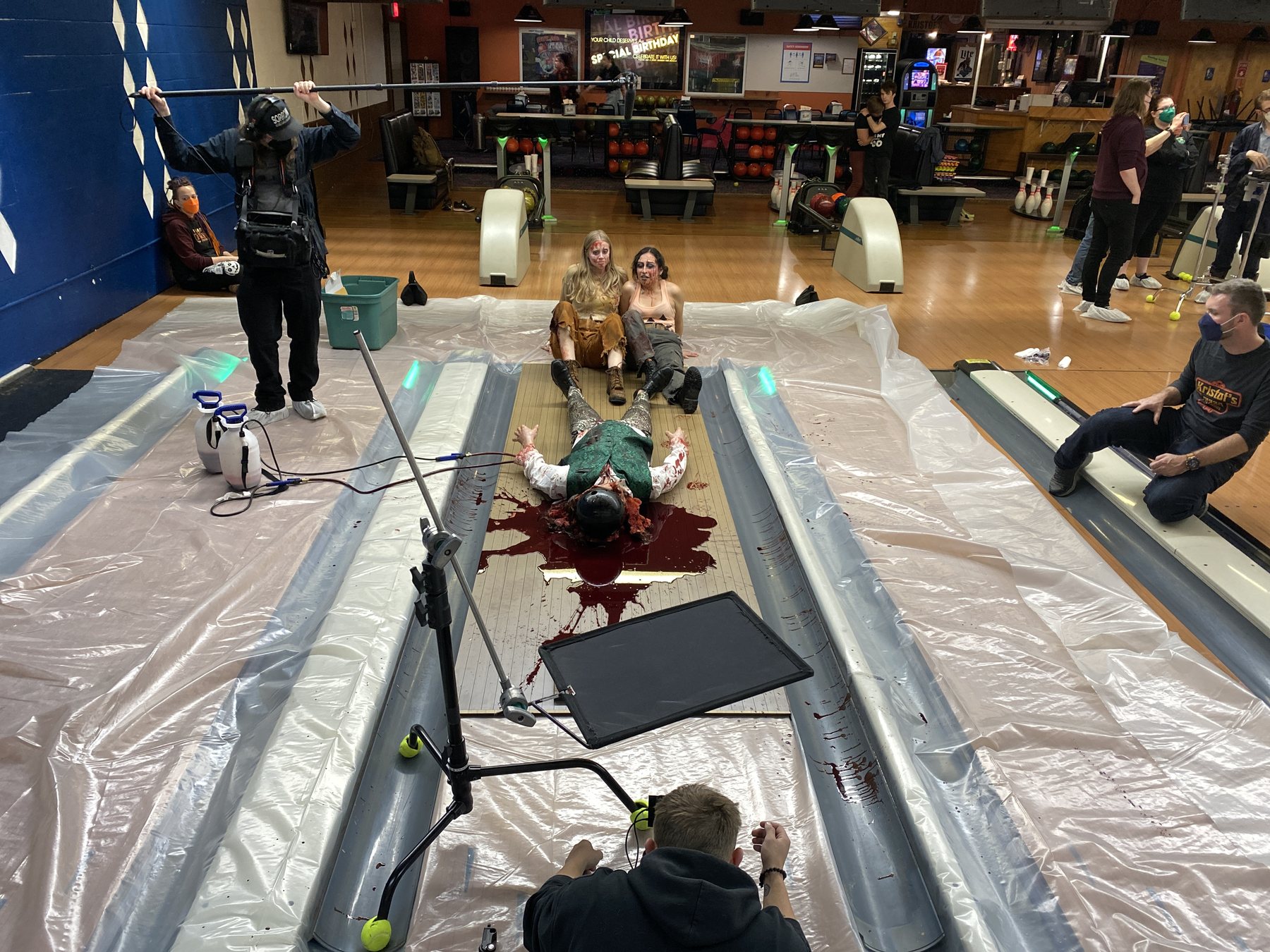 A bowling-lane practical-effects setup during filming.