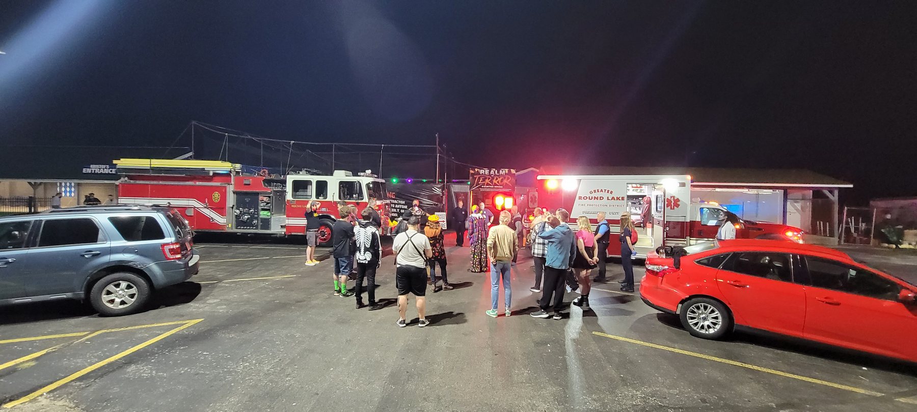 The crew sets up an exterior emergency-response scene at the haunt.