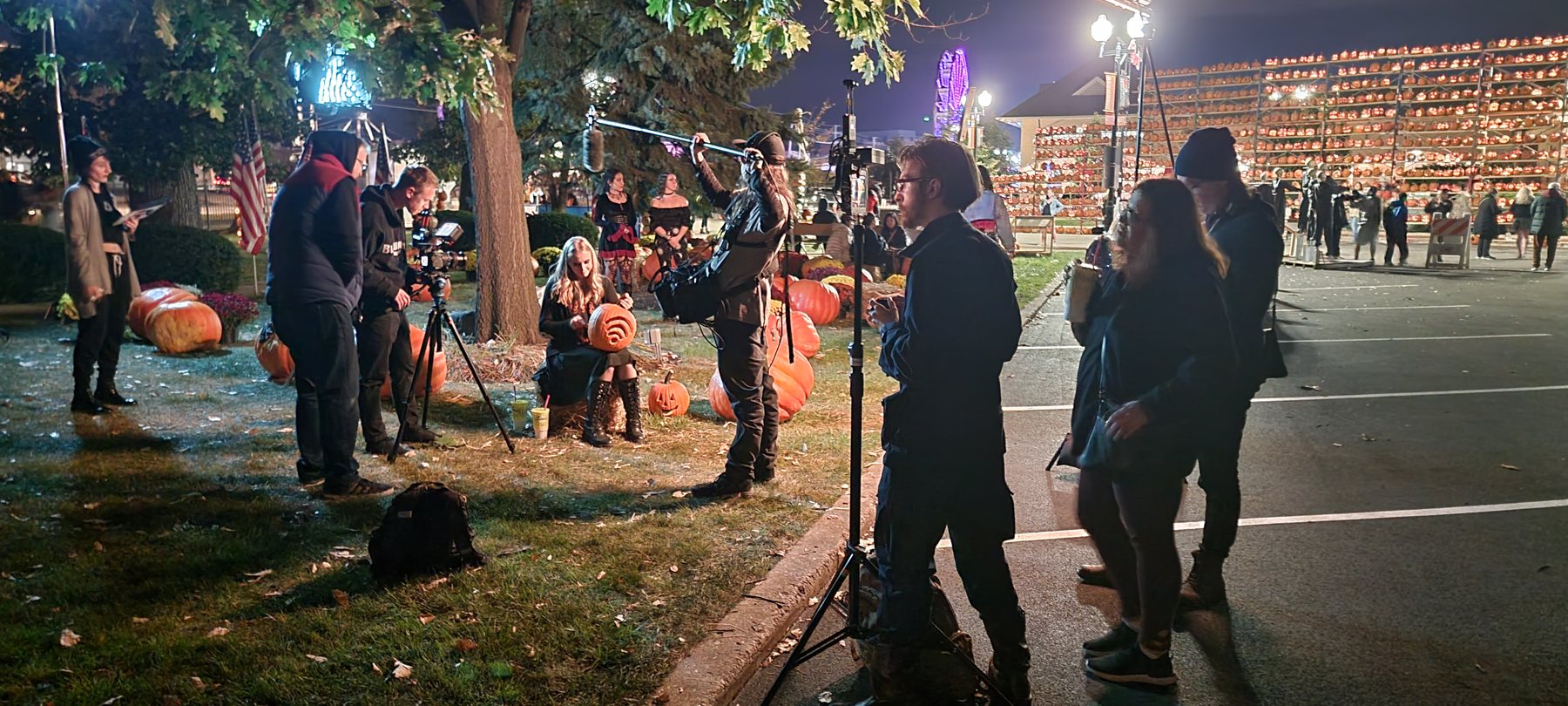 Night production around the pumpkin display and exterior event area.
